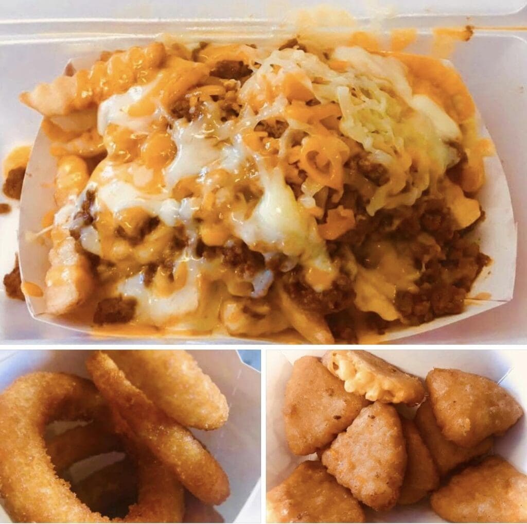 Three-section takeout tray: top is cheesy loaded nachos or fries with melted cheese and beef; bottom left shows onion rings; bottom right shows breaded chicken nuggets.
